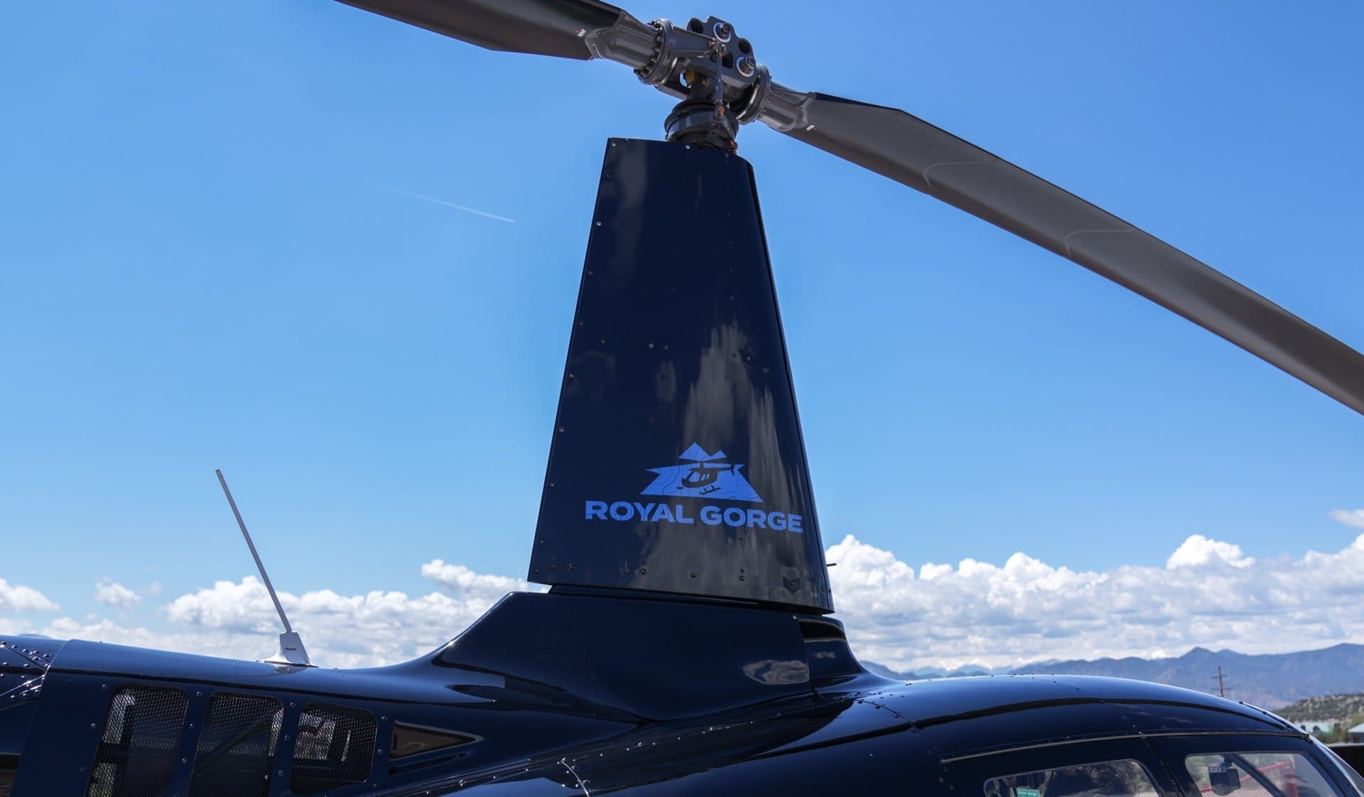ROYAL GORGE branding on the helicopter rotor mast with mountain and bridge logo